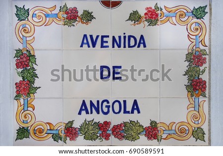 decorated tile plaque in street at south of Portugal; " Angola Avenue "