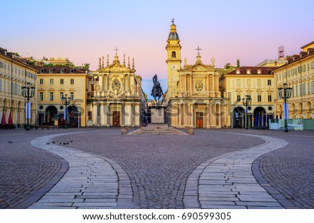 Piazza San Carlo square and twin churches of Santa Cristina and San Carlo Borromeo in the Old Town center of Turin, Italy, on sunrise Royalty-Free Stock Photo #690599305
