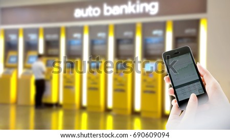 Businesswoman use digital mobile on ATM  background 
