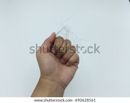 Hair Loss in Hand  Royalty-Free Stock Photo #690628561
