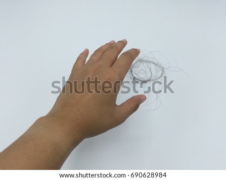 Hair Loss in Hand Royalty-Free Stock Photo #690628984