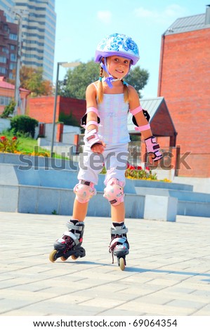 smiling 5 year old girl speedy going on her in-line skates