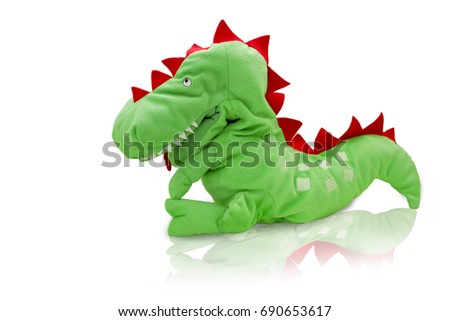 Green plush dinosaur doll isolated on white background with reflect shadow