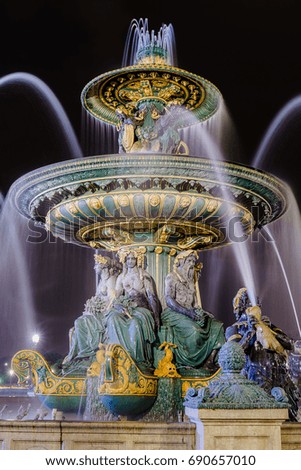 The Fontaines de la Concorde are two monumental fountains located in the Place de la Concorde in the center of Paris at night.