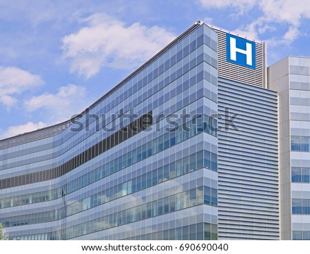 modern hospital style building  Royalty-Free Stock Photo #690690040