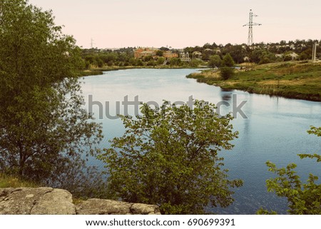 Landscape. River , water, greens . Ukraine. Village