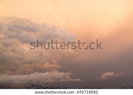 Sunset with clouds after the rain over dormitory area