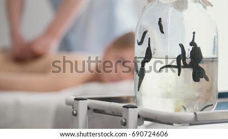 Bank with medical leeches - hirudotherapy in clinic Royalty-Free Stock Photo #690724606