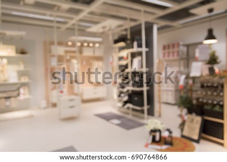 blur picture background  of wooden chest of drawer  or wardrobe in furniture mall
