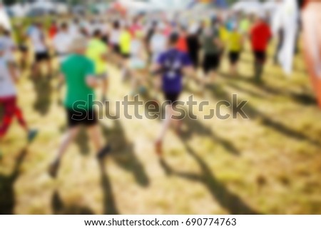 Defocused photo of running athletes