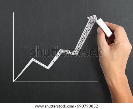 drawing results graph with white chalk on blackboard