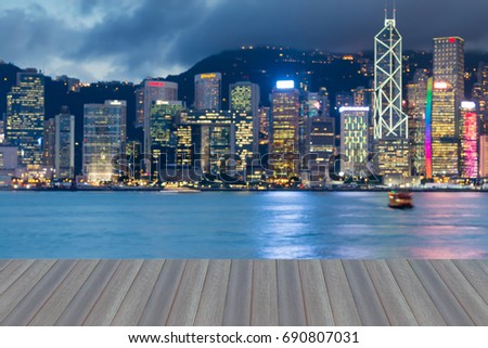 Opening wooden light, Blurred bokeh light Hong Kong city downtown over Victoria Bay, abstract background