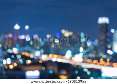 Twilight blurred bokeh light office building downtown, abstract background