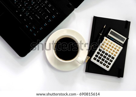 cup of coffee with laptop,calculator and book on white background. work space concept