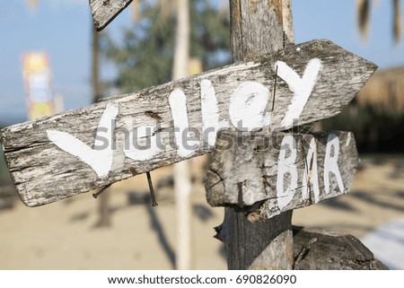 Old wooden pointer at the beach, summer shoot 
