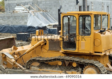 Photo of bulldozer on building site.