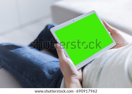 The tablet in the hands of man