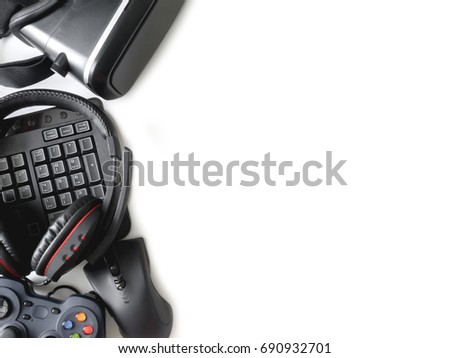 gamer workspace concept, top view a gaming gear, mouse, joystick, keyboard, headset, webcam, VR Headset on white background with copy space.