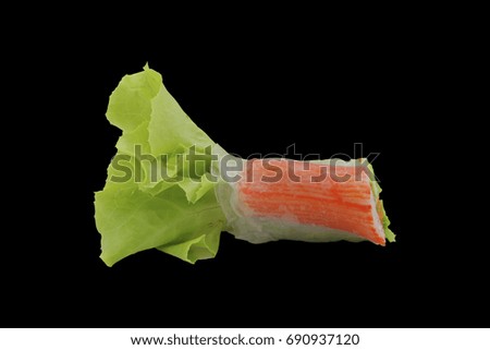 salad roll isolated on black background