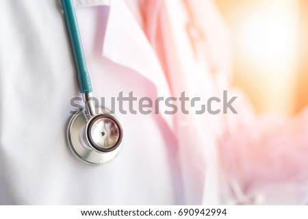 Medical doctor or physician in white gown uniform with stethoscope in hospital or clinic Royalty-Free Stock Photo #690942994