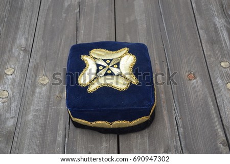 Traditional islamic muslim hat or cap from Uzbekistan Royalty-Free Stock Photo #690947302