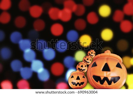 Halloween pumpkin party on colorful bokeh background