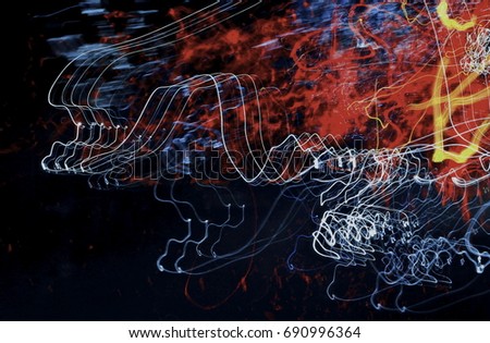 Art images. Abstract effect. The wild light from the car lights and street lights enters the camera lens along the highway at night. Long exposure shutter.