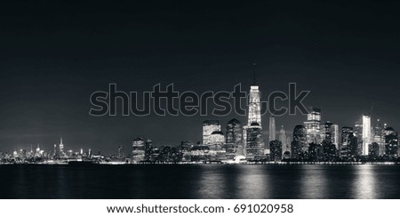 New York City downtown skyline at night panorama over Hudson River