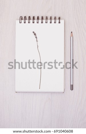 Lavender desk design with flowers on white background top view mock up. White paper postcard
