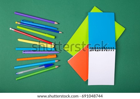School office stationery on green background