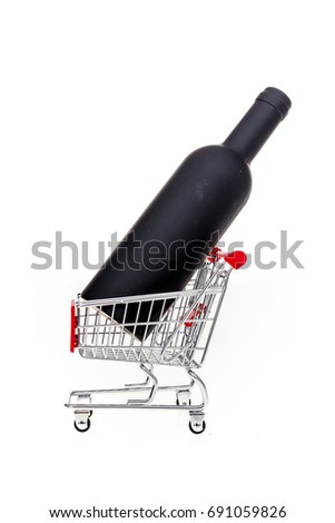Shopping cart with wine bottle in it conceptual image for wine shop