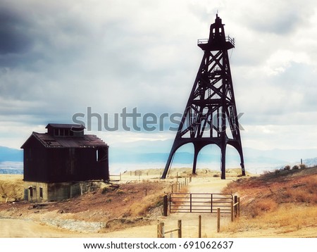 old mining headframes in a huge copper mine, Butte, Montana, United States Royalty-Free Stock Photo #691062637
