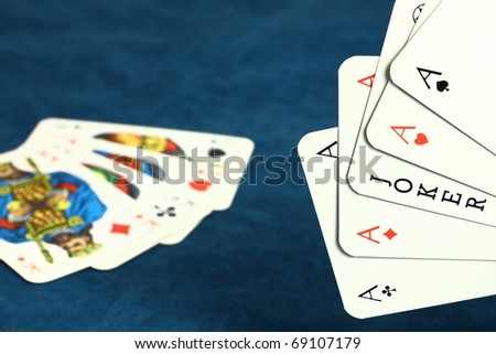 Playing hazard game by poker cards on dark blue background