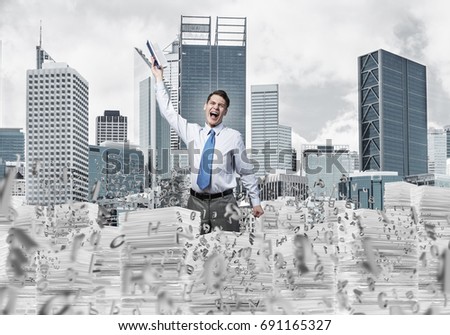 Young businessman keeping hand with book up while standing among flying letters with cityscape on background. Mixed media.