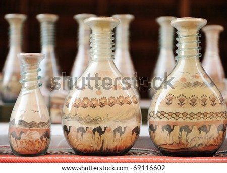 souvenirs - bottles with sand and shapes of desert and camels