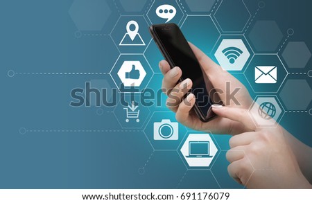 Close up of female hands with generic design smartphone and various apps infographics. Copy space for your text.