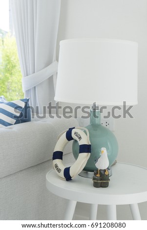 beach style living room with table lamp
