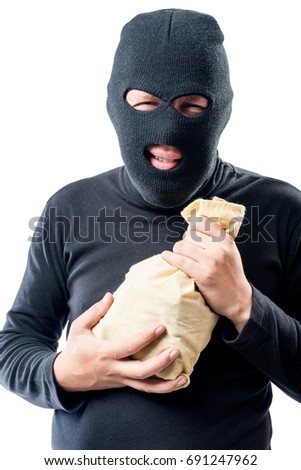 Robber in a mask with a bag of money on a white background