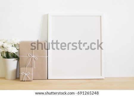 white frame photo with gift box on table. Special thanks or Christmas  