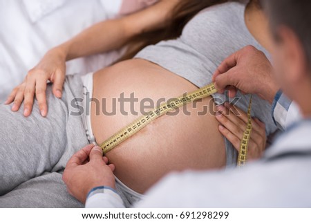 Top view picture of pregnancy that lying on bed