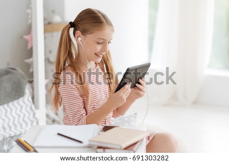 Child watching cartoons on digital tablet