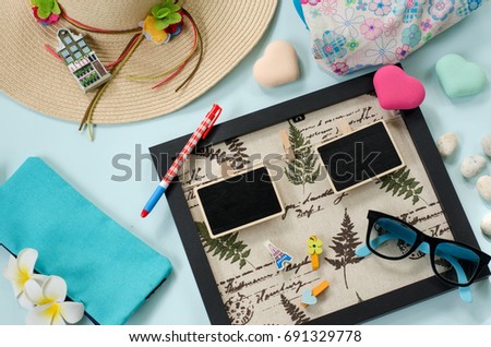 Holidays and day off concept. empty picture frame for travel and holiday props on blue sea background