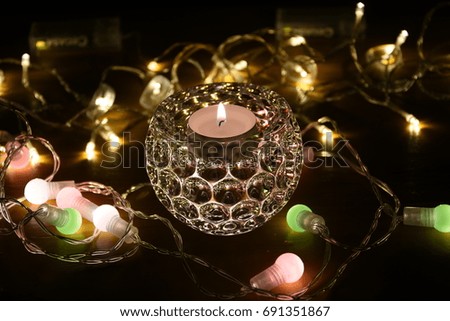 Night romantic light with glass candle