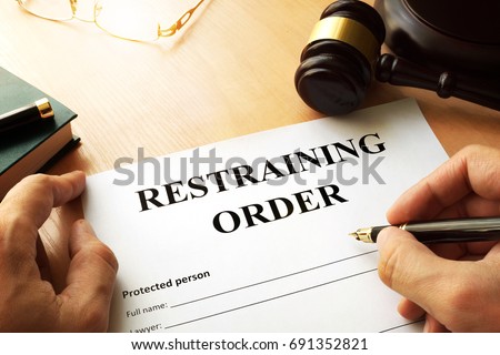 Document with the name restraining order. Royalty-Free Stock Photo #691352821