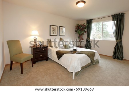 Bedroom with white and green bedding
