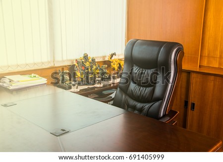 Empty workplace in office, Office for boss with sun illumination Royalty-Free Stock Photo #691405999