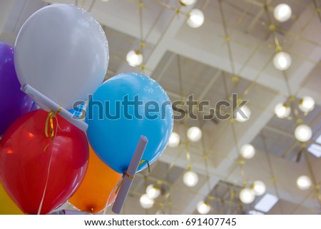 Multicolored, helium-filled balls on the holiday
