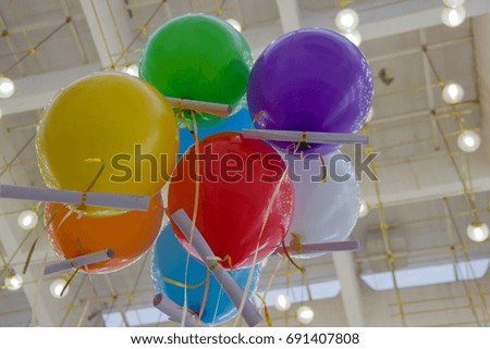 Multicolored, helium-filled balls on the holiday
