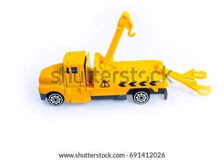 Toy tow truck yellow vehicles for kid children on white background 
