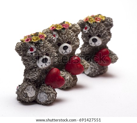 baby bears with hearts and flowers on a white background/baby bear with heart/ isolated objects,figurines,toys